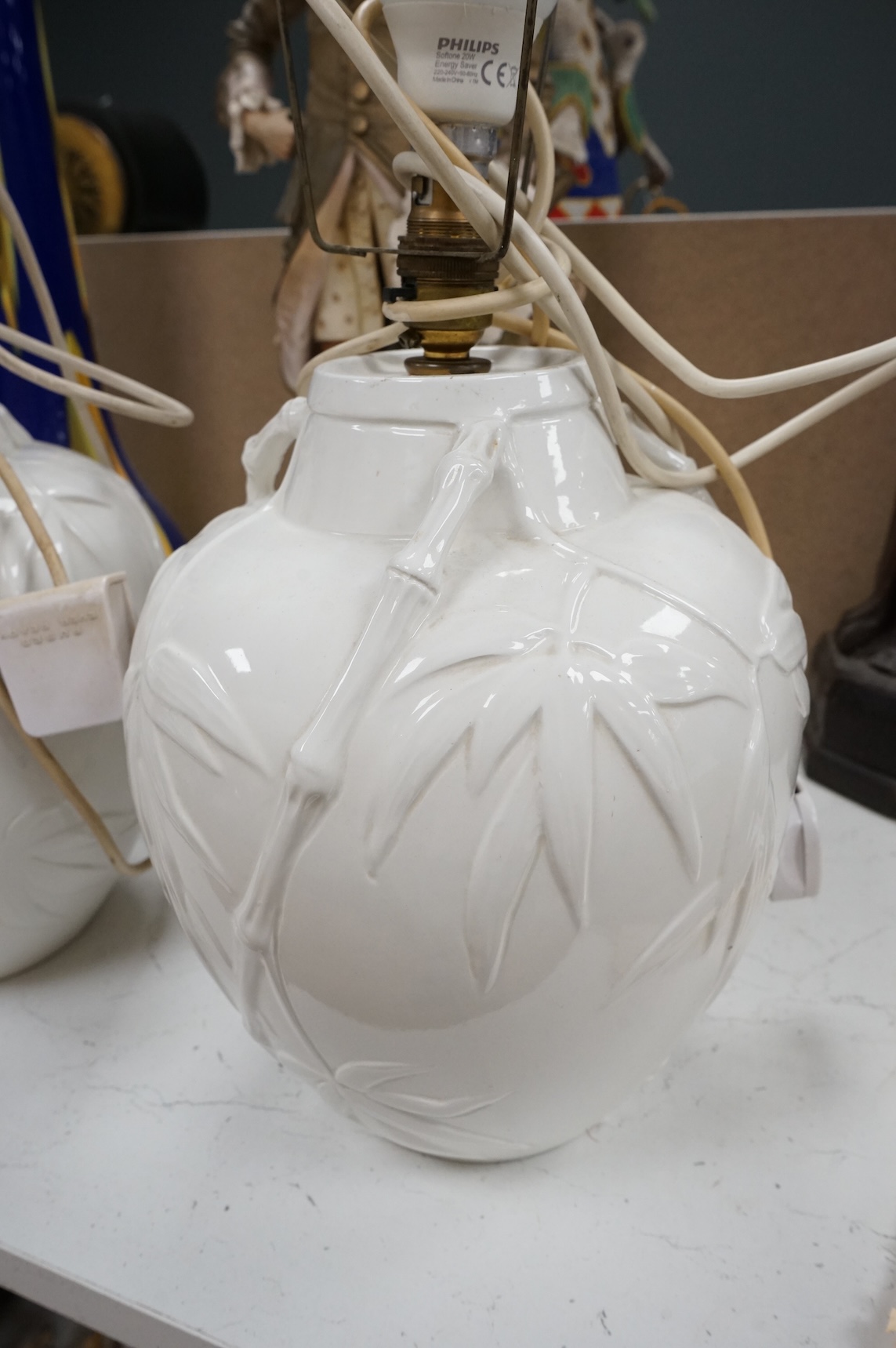 A pair of Chinese porcelain table lamps decorated with bamboo